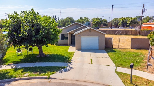 829 W Woodward Ave, Fresno, CA 93706 - view of front of property with driveway, stucco siding, and a garage