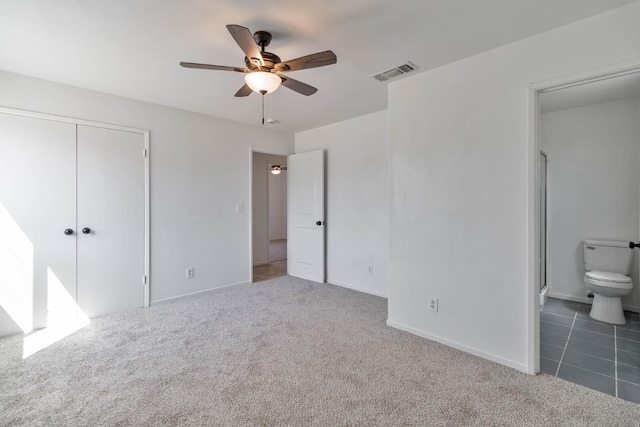 829 W Woodward Ave, Fresno, CA 93706 - unfurnished bedroom with carpet floors, a closet, connected bathroom, and baseboards