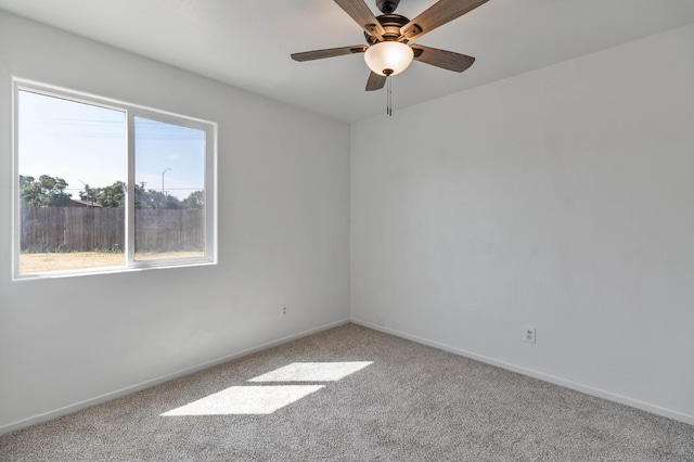 829 W Woodward Ave, Fresno, CA 93706 - empty room featuring carpet, a ceiling fan, and baseboards