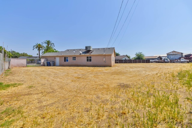829 W Woodward Ave, Fresno, CA 93706 - rear view of house with cooling unit and stucco siding