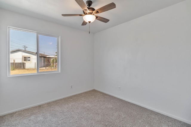 829 W Woodward Ave, Fresno, CA 93706 - carpeted empty room with baseboards and ceiling fan