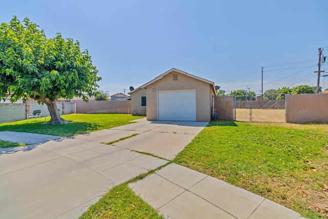 829 W Woodward Ave, Fresno, CA 93706 - view of front of home with stucco siding, concrete driveway, and a garage