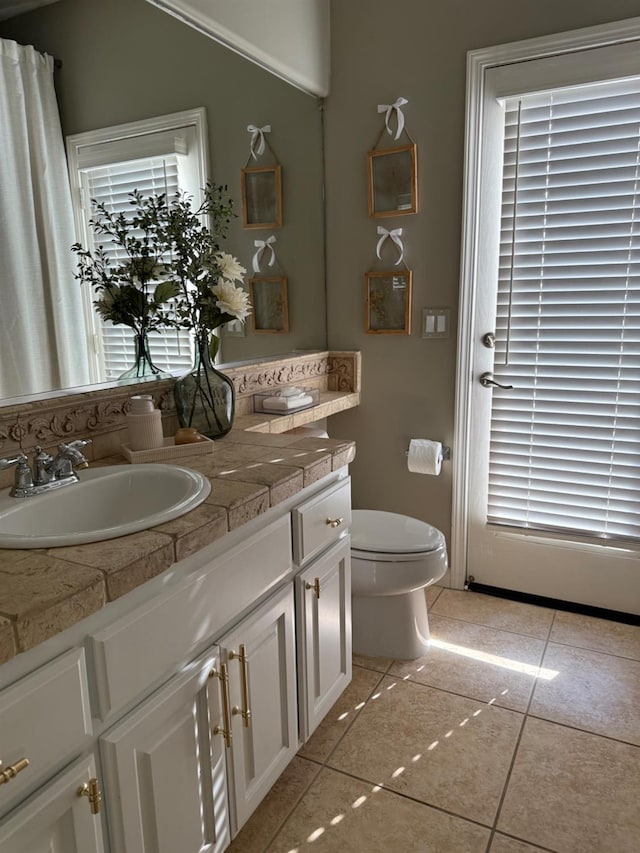 9130 Hunters Creek Way, Chowchilla, CA 93610 - bathroom with vanity, toilet, and tile patterned floors