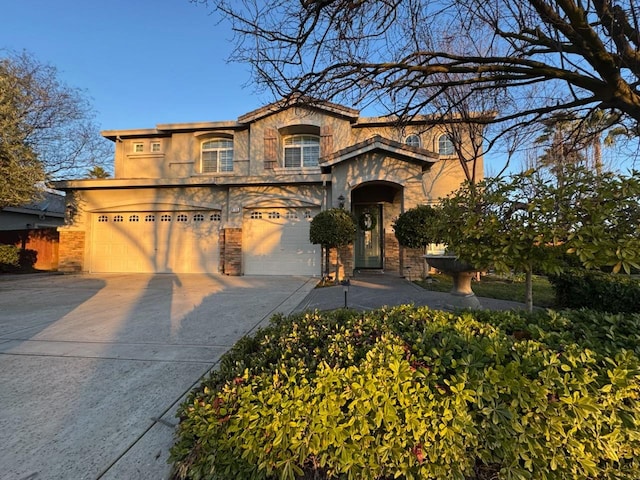 9130 Hunters Creek Way, Chowchilla, CA 93610 - view of front of property with an attached garage, driveway, and stucco siding