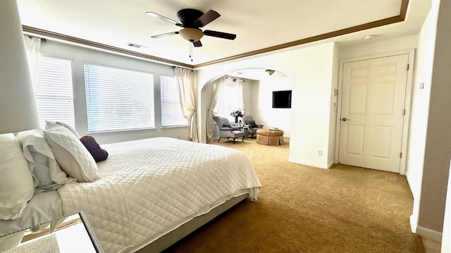 9130 Hunters Creek Way, Chowchilla, CA 93610 - carpeted bedroom featuring arched walkways, baseboards, a ceiling fan, and ornamental molding