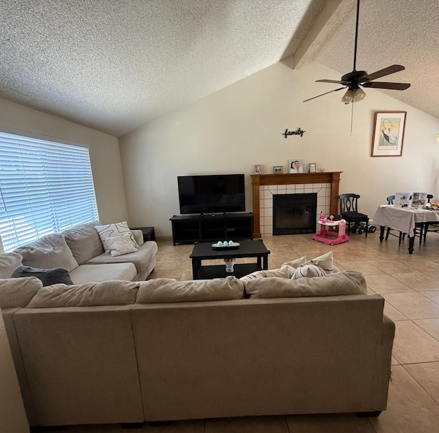 4352 W Los Altos, Fresno, CA 93722 - living area with light tile patterned floors, a textured ceiling, ceiling fan, and a fireplace