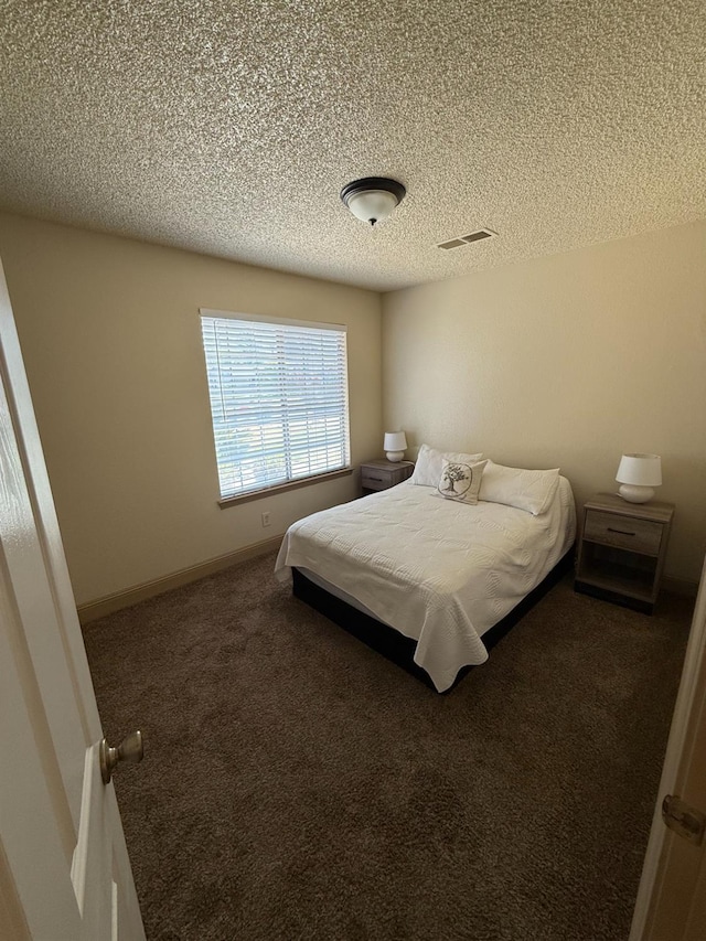 4352 W Los Altos, Fresno, CA 93722 - bedroom featuring a textured ceiling and carpet floors
