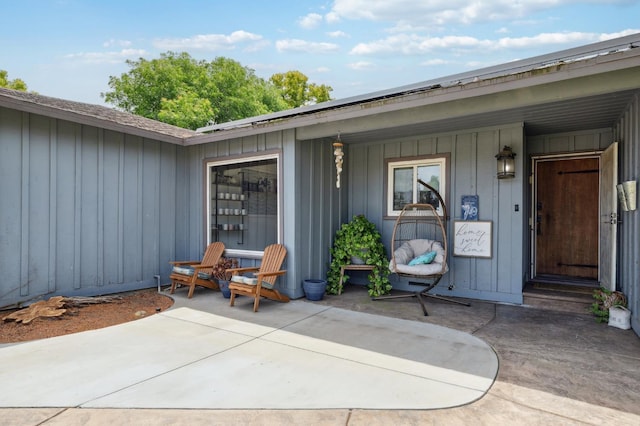5554 E Montecito Ave, Fresno, CA 93727 - doorway to property featuring board and batten siding and a porch