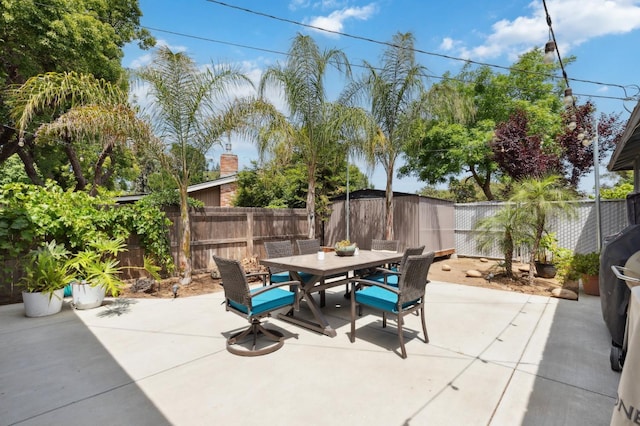 5554 E Montecito Ave, Fresno, CA 93727 - fenced backyard featuring outdoor dining area and a patio