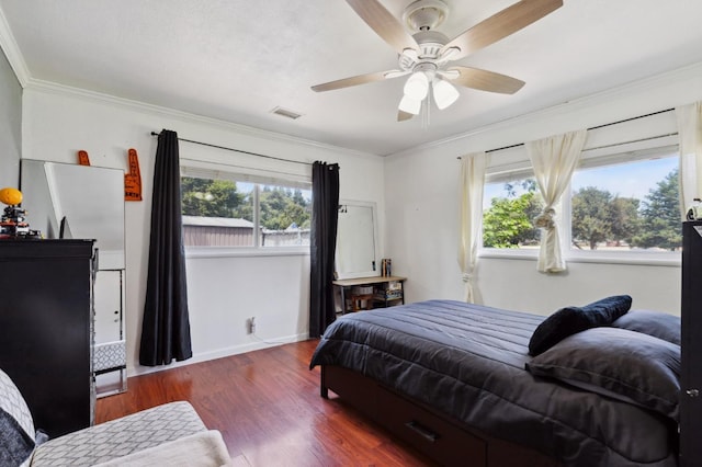 5554 E Montecito Ave, Fresno, CA 93727 - bedroom featuring multiple windows, wood finished floors, crown molding, baseboards, and ceiling fan