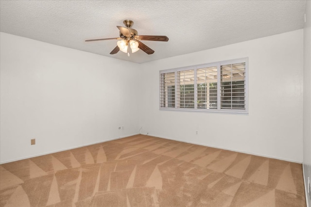 4705 N Holt Ave, Fresno, CA 93705 - empty room featuring carpet flooring, ceiling fan, a textured ceiling, and baseboards