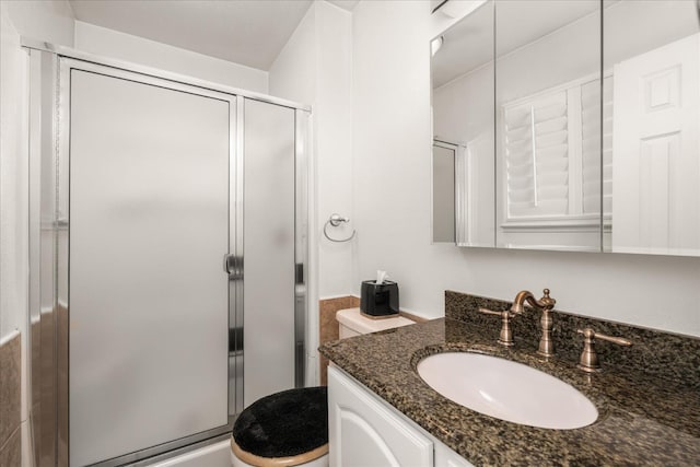 4705 N Holt Ave, Fresno, CA 93705 - bathroom featuring vanity, a shower stall, and toilet