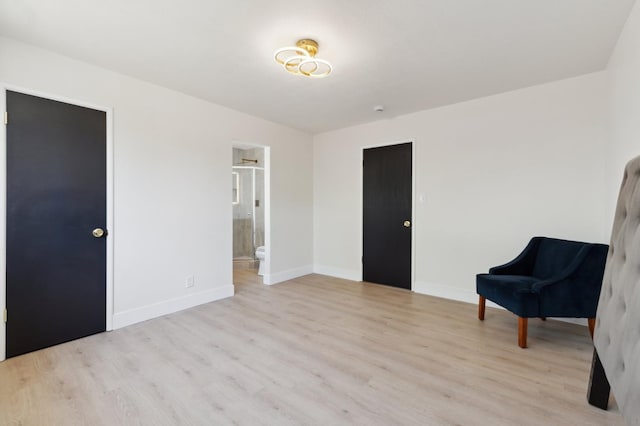 4489 N Chestnut Ave, Fresno, CA 93726 - living area with light wood finished floors and baseboards