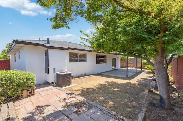 4489 N Chestnut Ave, Fresno, CA 93726 - back of house with cooling unit, a patio area, stucco siding, and roof with shingles