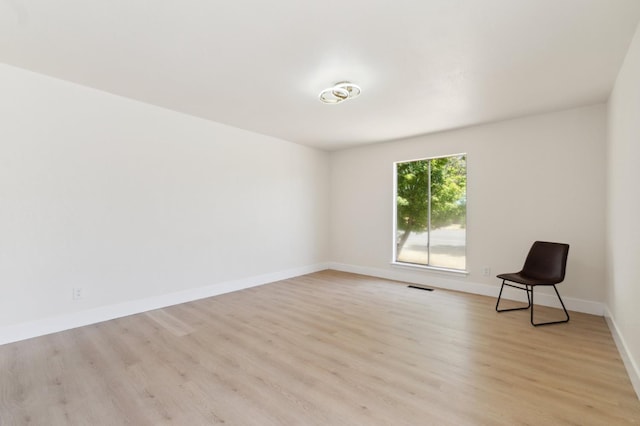 4489 N Chestnut Ave, Fresno, CA 93726 - spare room featuring light wood-style floors and baseboards
