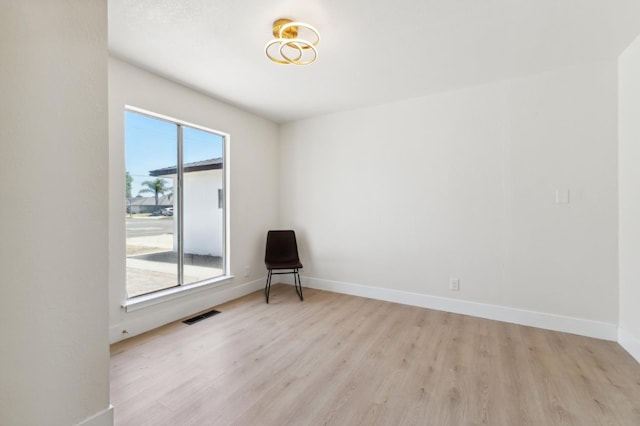 4489 N Chestnut Ave, Fresno, CA 93726 - spare room with light wood-style floors and baseboards