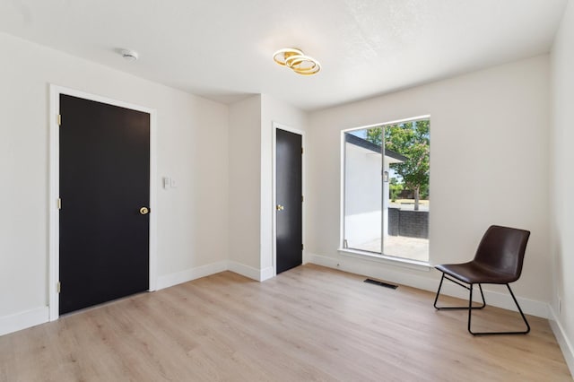 4489 N Chestnut Ave, Fresno, CA 93726 - unfurnished room with light wood-type flooring and baseboards