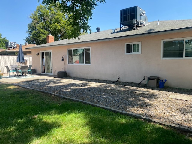 5815 E Lansing Way, Fresno, CA 93727 - rear view of house with a patio area, stucco siding, central AC, and a chimney