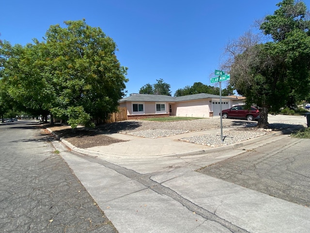 5815 E Lansing Way, Fresno, CA 93727 - view of front of property with driveway and an attached garage