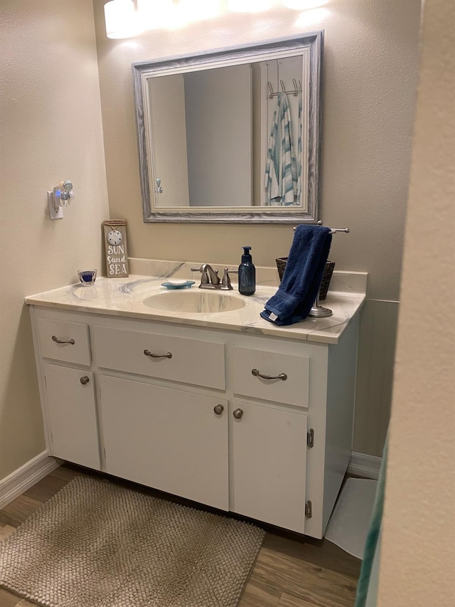 5815 E Lansing Way, Fresno, CA 93727 - bathroom with vanity and wood finished floors