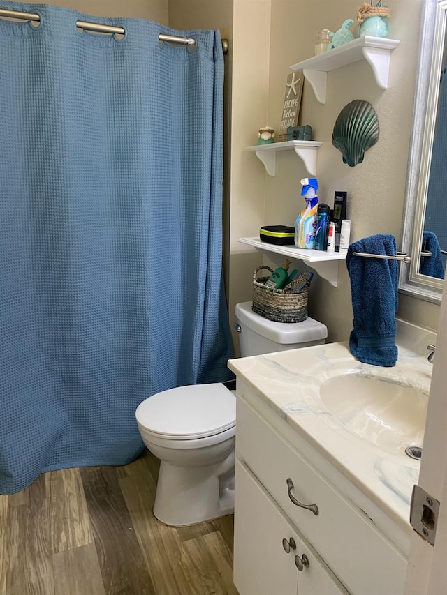 5815 E Lansing Way, Fresno, CA 93727 - bathroom featuring vanity, wood finished floors, toilet, and a shower with shower curtain
