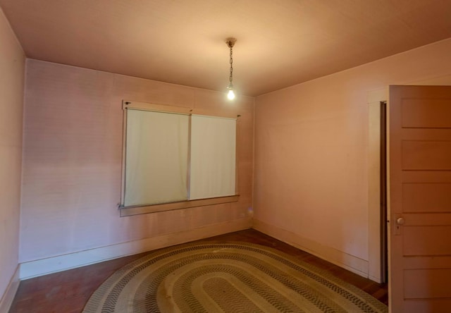 1007 E Michigan Ave, Fresno, CA 93704 - empty room featuring baseboards and dark wood-style floors