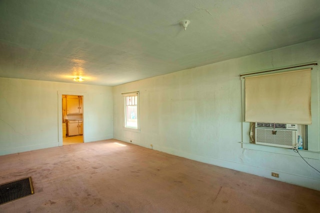 1007 E Michigan Ave, Fresno, CA 93704 - unfurnished room featuring cooling unit, carpet, and baseboards