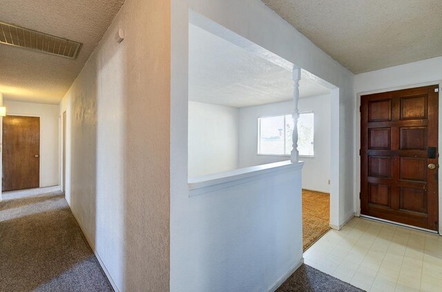 2100 E Linden Ave, Fresno, CA 93725 - carpeted foyer entrance featuring a textured ceiling and baseboards