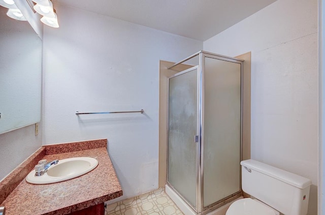 2100 E Linden Ave, Fresno, CA 93725 - bathroom with toilet, vanity, a shower stall, and tile patterned floors