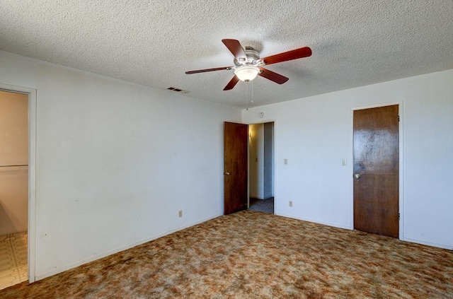 2100 E Linden Ave, Fresno, CA 93725 - unfurnished bedroom with carpet, a textured ceiling, and ceiling fan