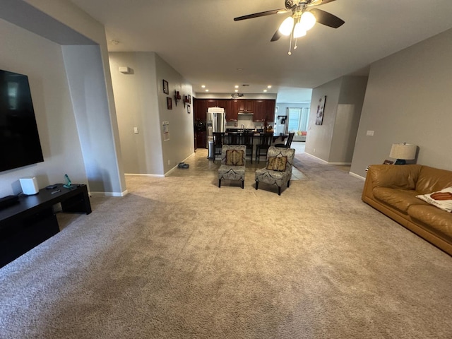 5312 W Cotton Ave, Fresno, CA 93722 - living room featuring ceiling fan, light carpet, baseboards, and recessed lighting