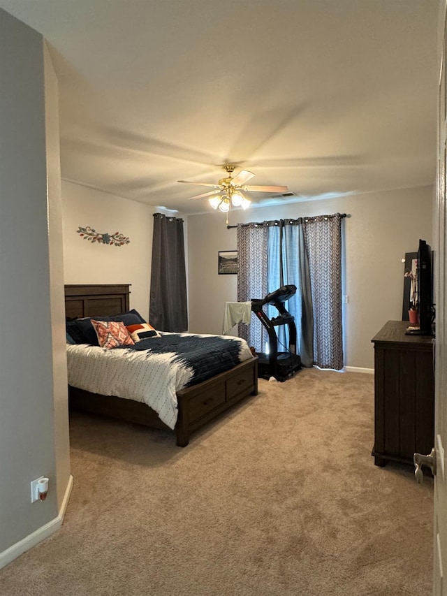 5312 W Cotton Ave, Fresno, CA 93722 - bedroom with light carpet, baseboards, and a ceiling fan