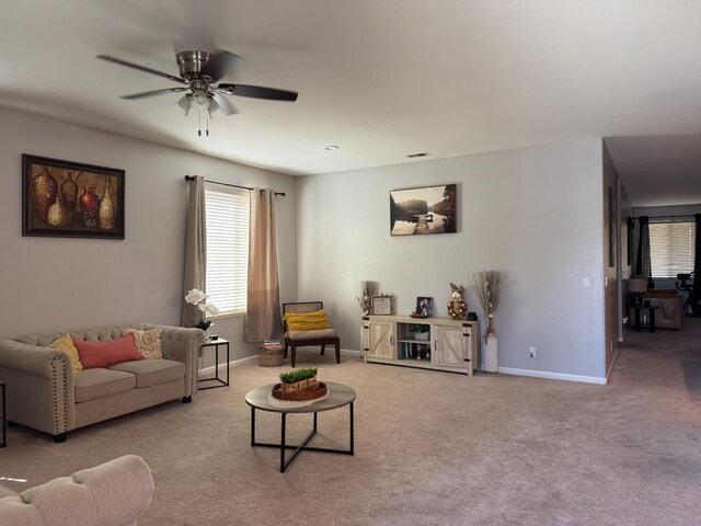 5312 W Cotton Ave, Fresno, CA 93722 - carpeted living room featuring ceiling fan and baseboards