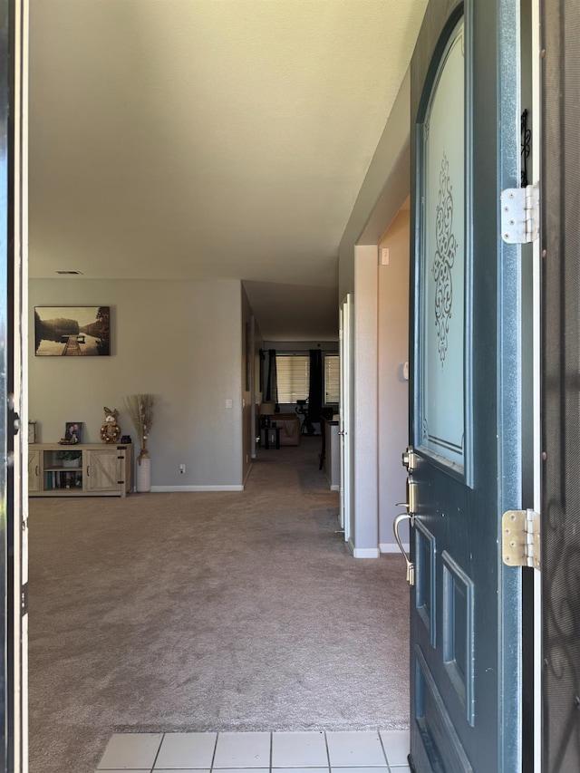 5312 W Cotton Ave, Fresno, CA 93722 - foyer featuring carpet, baseboards, and tile patterned flooring
