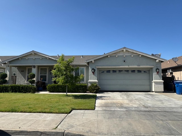 5312 W Cotton Ave, Fresno, CA 93722 - ranch-style house with a garage, concrete driveway, a front yard, and stucco siding