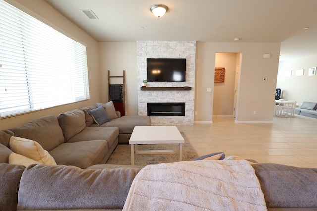 4090 Buckingham Ave, Clovis, CA 93619 - living area featuring a fireplace and baseboards