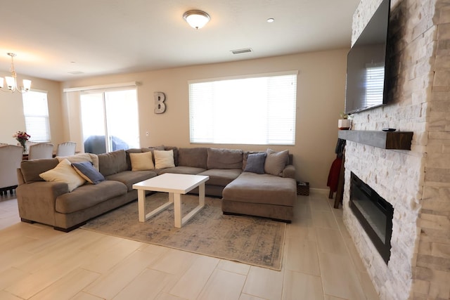 4090 Buckingham Ave, Clovis, CA 93619 - living room featuring a chandelier and a fireplace