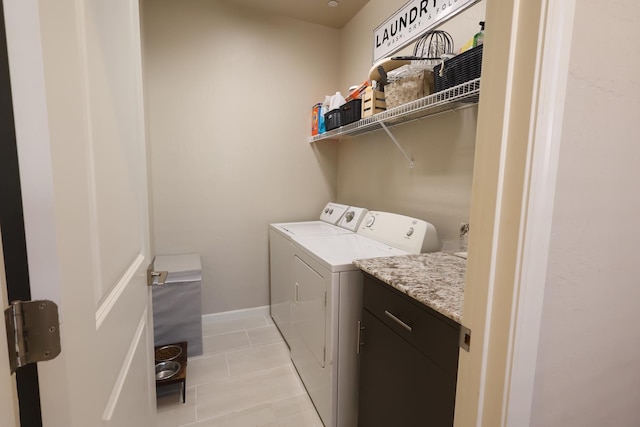 4090 Buckingham Ave, Clovis, CA 93619 - washroom featuring washing machine and dryer, light tile patterned flooring, and baseboards