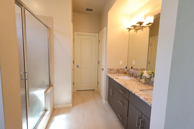 4090 Buckingham Ave, Clovis, CA 93619 - bathroom with double vanity, a shower stall, and tile patterned floors