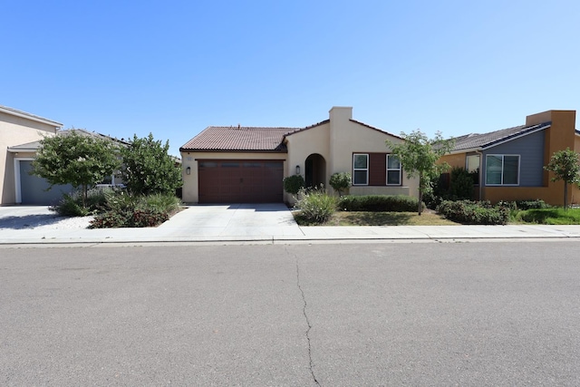 4090 Buckingham Ave, Clovis, CA 93619 - mediterranean / spanish home with an attached garage, driveway, stucco siding, and a tiled roof