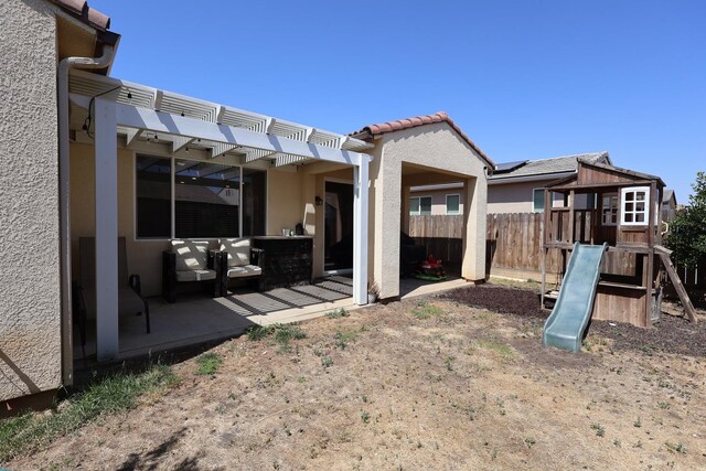 4090 Buckingham Ave, Clovis, CA 93619 - view of yard with a playground, a pergola, and a patio