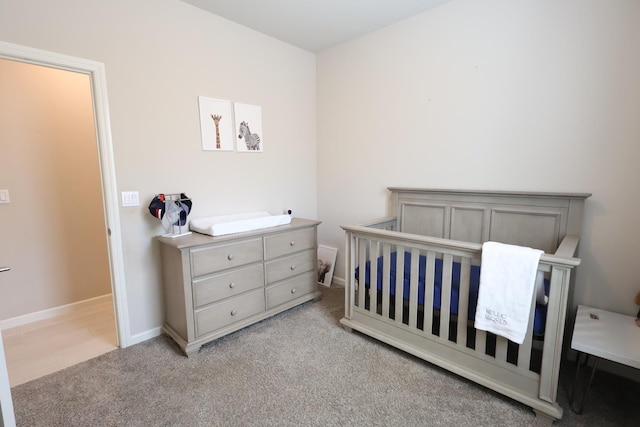 4090 Buckingham Ave, Clovis, CA 93619 - bedroom featuring light colored carpet, a nursery area, and baseboards