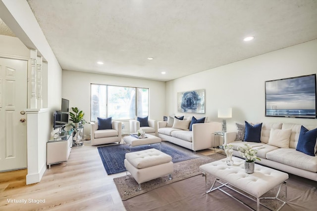 1448 N Helm Ave, Fresno, CA 93727 - living room featuring light wood-style floors and recessed lighting