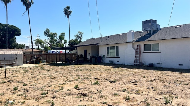 4202 N Manila Ave, Fresno, CA 93727 - back of house with central AC unit and roof with shingles