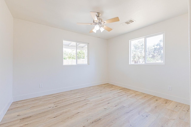 4930 E Olive Ave, Fresno, CA 93727 - empty room featuring wood finished floors, ceiling fan, and baseboards