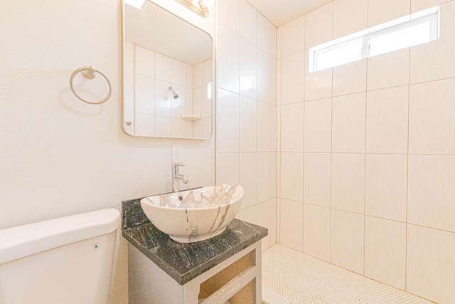 4930 E Olive Ave, Fresno, CA 93727 - full bath featuring vanity, toilet, and tiled shower