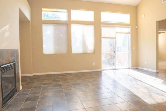 1850 N Dupree Ln, Clovis, CA 93619 - unfurnished living room featuring a fireplace and baseboards