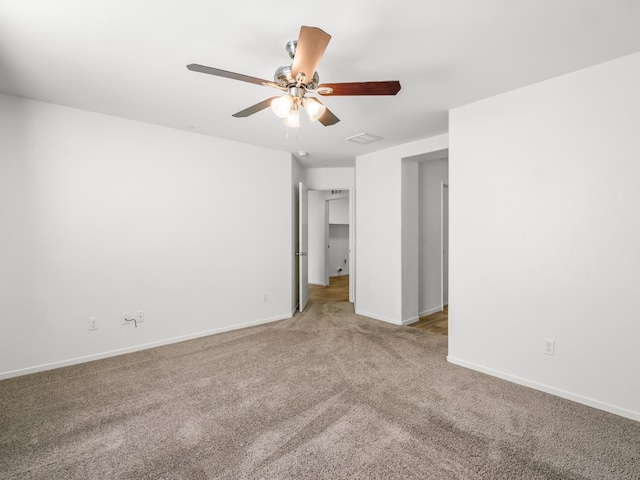 703 Tulip Cir, Dinuba, CA 93618 - unfurnished bedroom featuring carpet flooring, baseboards, and a ceiling fan