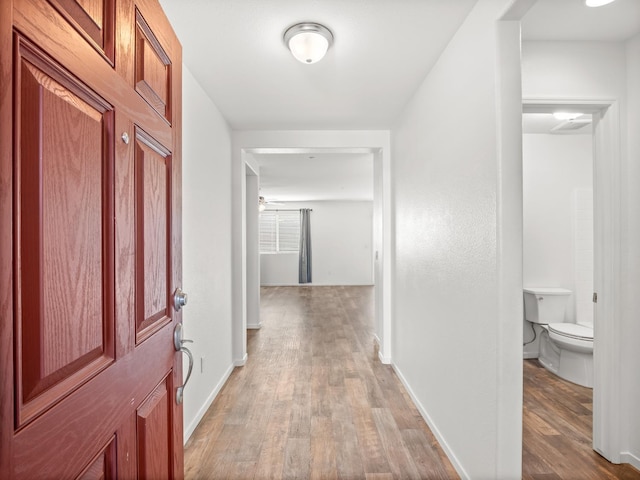 703 Tulip Cir, Dinuba, CA 93618 - foyer entrance featuring light wood-type flooring and baseboards