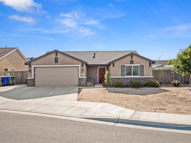 703 Tulip Cir, Dinuba, CA 93618 - single story home featuring stucco siding, stone siding, an attached garage, and driveway